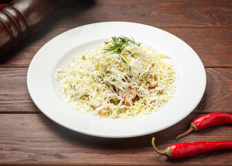 Egg and chicken salad. On a wooden background.
