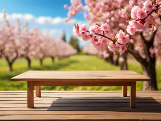 Spring background with empty wooden table. Natural template for product display with cherry blossoms bokeh and sunlight.