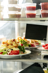 Showcase with salads in the dining room or cafeteria