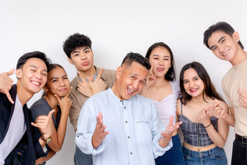 Fun shoot with 6 young interns posing with their boss. Startup company showing solidarity and unity. - obrazy, fototapety, plakaty
