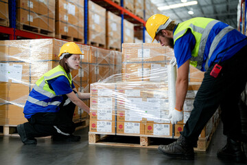 operation workers checking and inspecting cargo for stack items for shipping. males worker checking the store factory. industry factory warehouse. Worker Scanning Package In Warehouse.
