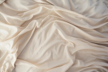 Cream satin fabric texture with soft waves.