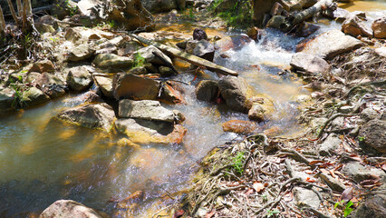 Natural View Of A Natural Freshwater River Flowing From The Mountains, With A Stretch Of Rocks