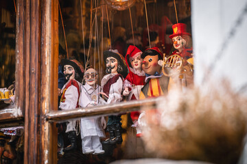Puppet show performed through a window.