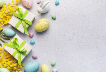Festive Easter Celebration With Decorated Eggs and Gifts on a Light Background