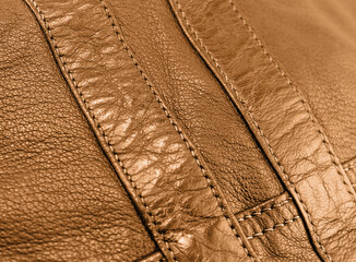 Macro shot leather texture background. Part of perforated brown leather details. Perforated leather...