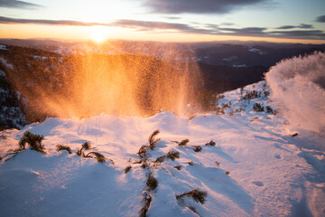 Beautiful landscape with snowdrifts in magic sunset