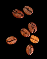 Coffee beans isolated on black background. Close-up