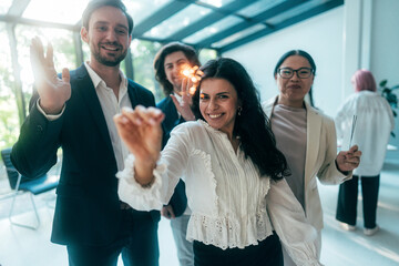 Businessmen and businesswomen making a corporate party