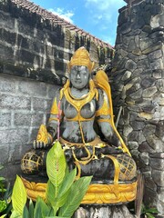 Buddha statue with gold accents at a temple