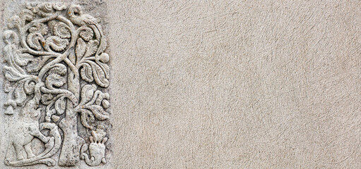 Horizontal background with stone bas-relief with tree, peacock and elephant. Backdrop with...