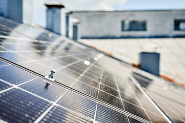 Close up of mounting hardware on solar panel, focusing on the details of the securing mechanism....
