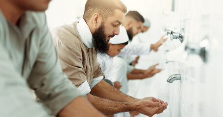 Muslim, religion ritual and men washing before prayer in bathroom for purity, and cleaning. Islamic, worship and faith of group of people with wudu together at a mosque or temple for holy practice - obrazy, fototapety, plakaty