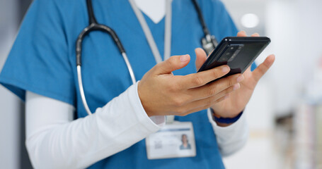 Hands, phone and healthcare with a nurse scrolling in a hospital closeup for research or...