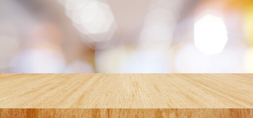 Wood table background and blur background, Empty wooden counter, shelf surface over blur restaurant with bokeh background,  store product display backdrop, banner, mock up, template