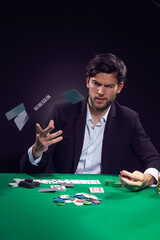 Addiction Concepts. Angry Depressed Handsome Caucasian Brunet Pocker Player At Pocker Table With Chips and Cards Drinking Alcohol
