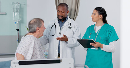Fototapeta premium Doctor, nurse and patient in discussion in hospital got medical diagnosis or treatment plan. Clipboard, consultation and team of healthcare workers talking to a senior man with checklist in a clinic.
