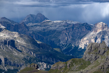 Fototapeta na wymiar Panoramic view from the top of the Marmolada Glacier in summer mist, Dolomites, South Tyrol, Italy.