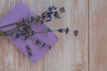 Handmade aromatic spa lavender soap. Natural additives and extracts. Bar of lavender soap with dried flowers. Beauty treatment product herbal ecological organic cosmetics