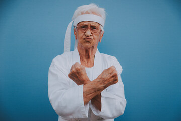 Funny grandmother portraits.granny fashion model on colored backgrounds. Karate master practicing martial arts - 733637648