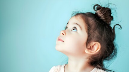 Close up portrait of cute little girl looking above. Concept of curious ,imiginative, new idea,...