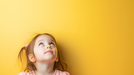 Close up portrait of cute little girl looking above. Concept of curious ,imiginative, new idea,...
