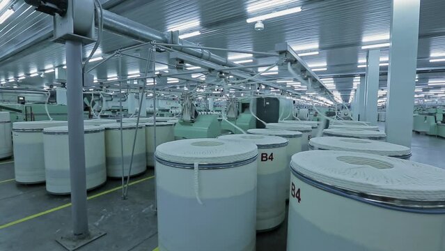 Textile factory, industrial textile production. Factory for the production of cotton yarn, spinning machines.
