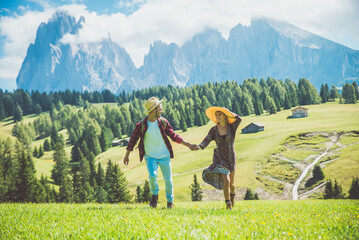 Fototapeta na wymiar Happy couple on vacation on the italian dolomites mountains