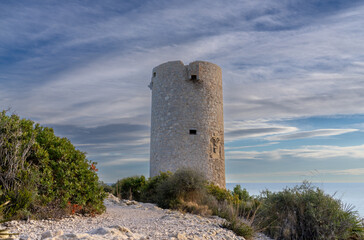 Fototapeta na wymiar Torre Badum, Sentinel Tower on the cliffs of the Sierra de Irta, spain 