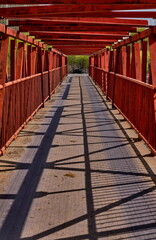 A red bridge made of metal structures