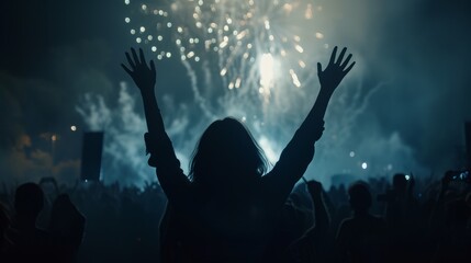 a crowd of people raising their hands in front of a spectacular fireworks display. celebration in the crowd. The atmosphere is filled with smoke and light, creating an ethereal effect. - obrazy, fototapety, plakaty