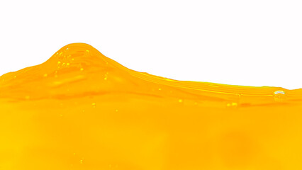 Close-up photo of bright orange juice. Yellow, orange juice for health and natural waves. White background isolated.