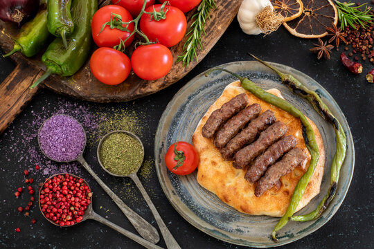 Grilled burgers on the pita bread named cevapi , souvlaki , şiş or ineg&ouml;l k&ouml;fte
