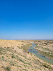 A beautiful river surrounded by wild nature and incredible views. The rocky bottom and banks make this river very formidable and inaccessible in appearance.