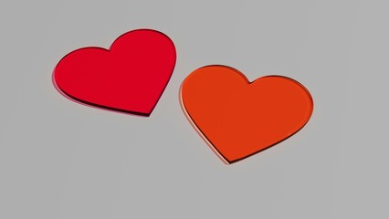 Dwa szklane czerwone pomarańczowe serca na szarym tle © Greg [RenderMania]