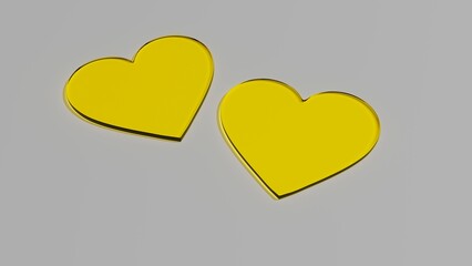 Dwa szklane żółte serca na szarym tle © Greg [RenderMania]