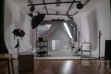 Interior of modern photo studio with octaboxes and professional photo camera on tripod