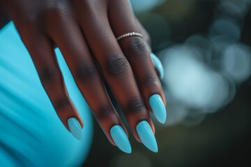 Stylish Woman's Manicured Hand With Eye-Catching Ice Blue Nail Polish In Closeup - obrazy, fototapety, plakaty