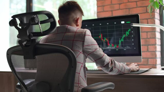 Cryptocurrency market, a young trader working with financial exchanges in a modern country office, cryptocurrency business, broker at work.