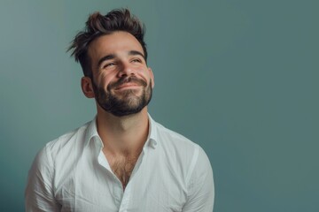 Fototapeta premium Handsome and Successful Man Sporting a Beard, Radiating Confidence and Charm in a Crisp White Shirt, His Smile Illuminating the Room