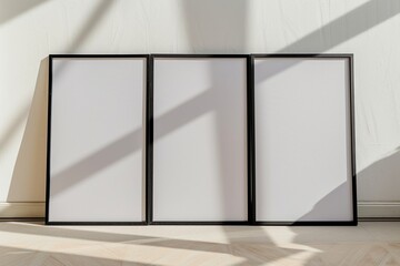 Picture frame mockup, three picture frames in front of a wall