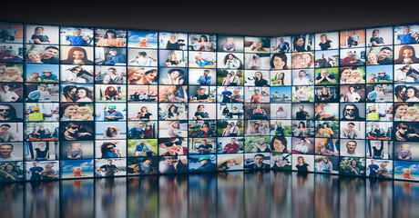 Digital wall with screens featuring various people. Modern global communication and network
