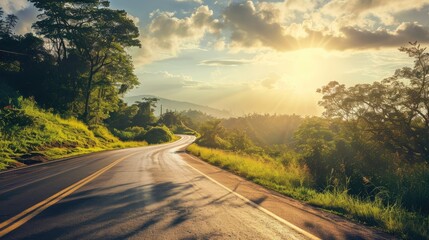 Empty long mountain road to the horizon on a sunny summer day at bright sunset