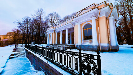 Travel Saint-Petersburg Russia in winter. Landscape with quay and classic ancient Greel style arbor...