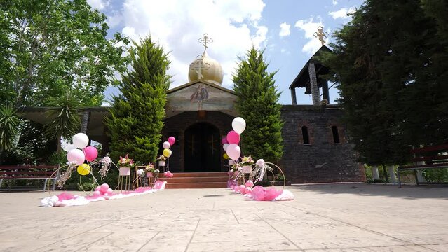 The Orthodox Greek church outside is decorated before the christening ceremony