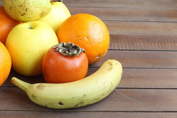 fruits on wooden table. healthy diet concept