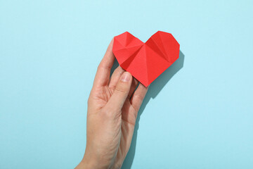 Heart on a blue background, the concept of treating cardiovascular diseases.
