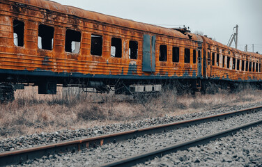 Fototapeta na wymiar burned out blown up wagons in Ukraine