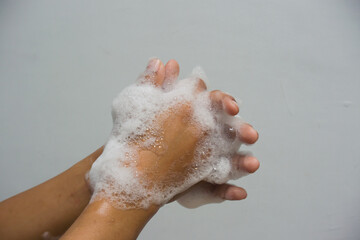Little childs hands full of soap foam