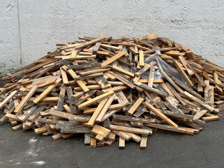 Large pile of dirty wooden planks